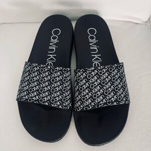Calvin Klein Black Logo Slide Sandals.